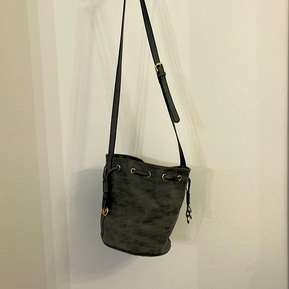Grey faux leather bucket bag.
